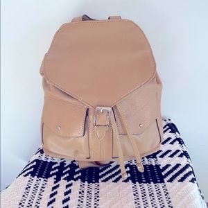 Used in good shape Macy’s Real Leather tan backpack style purse.